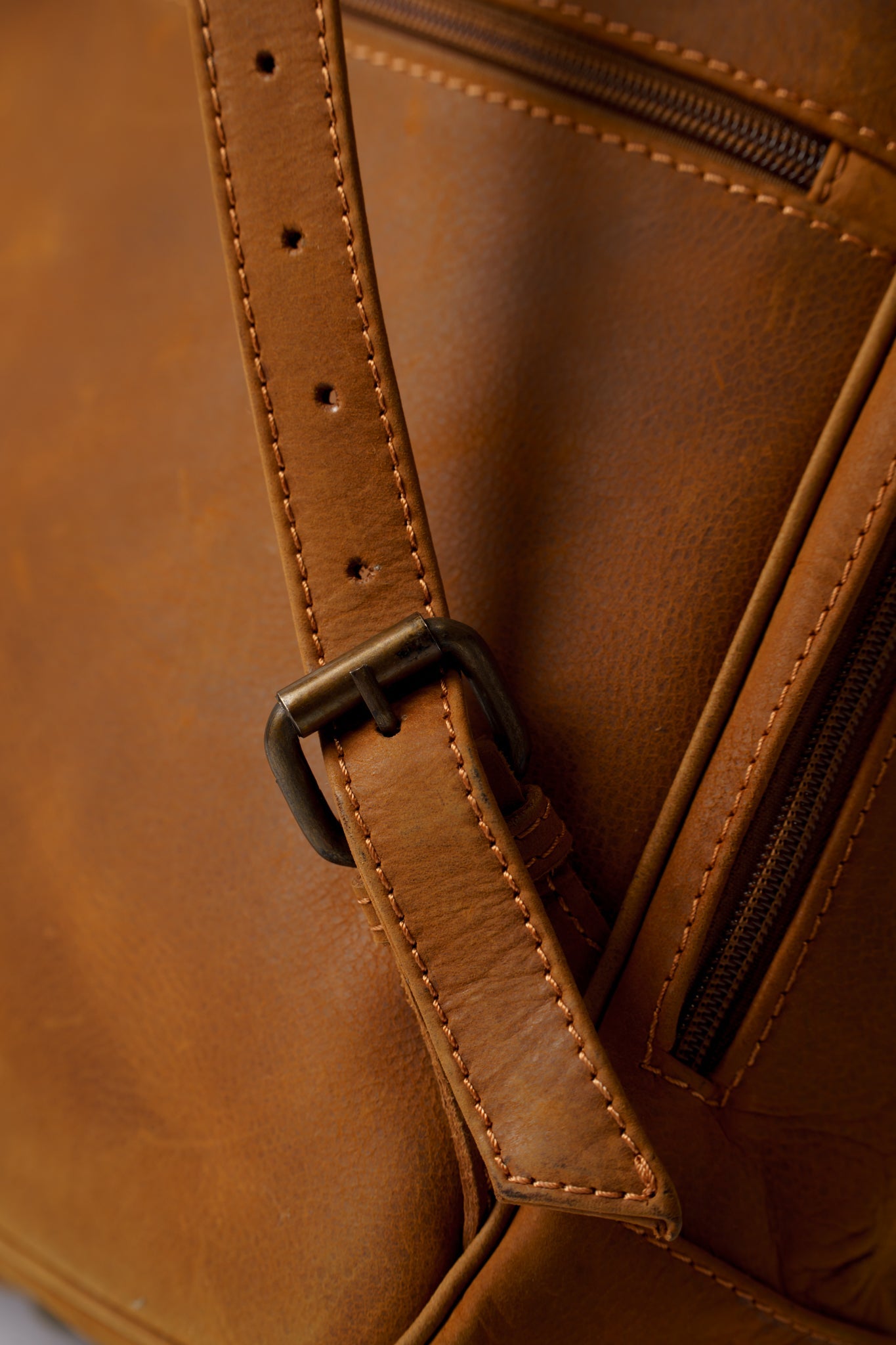 Closeup of the high quality metallic buckles on Chamra's satchel bacpack.