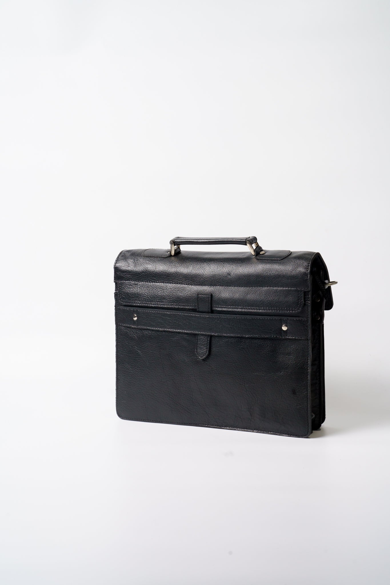 Front view of Chamra's black business laptop bag. Sleek small pockets can be seen, big enough to fit thin notebooks or documents.